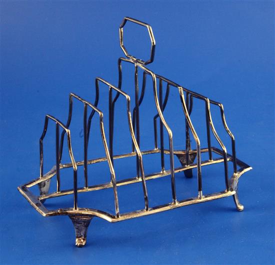 A George III silver seven bar toast rack, 5.5 oz.